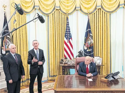  ??  ?? RACE FOR A CURE: Daniel O’Day, head of Gilead Sciences, manufactur­er of remdesivir, stands in-between Vice President Mike Pence and President Donald Trump as they discuss the US bid to find a vaccine.