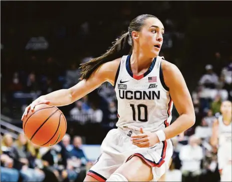  ?? Jessica Hill / Associated Press ?? UConn’s Nika Muhl is on pace to set the program’s single-season record for assists.