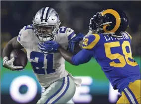  ?? MARK J. TERRILL - THE ASSOCIATED PRESS ?? FILE - In this Jan. 12, 2019, file photo, Dallas Cowboys running back Ezekiel Elliott pushes off Los Angeles Rams inside linebacker Cory Littleton during the first half in an NFL divisional football playoff game in Los Angeles.