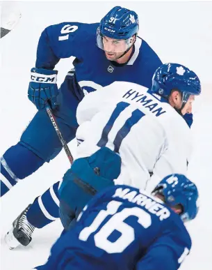  ?? AARON LYNETT THE CANADIAN PRESS ?? John Tavares, Zach Hyman and Mitch Marner have been playing together so far during Maple Leafs training camp. Hyman, for one, would be happy if that continues.