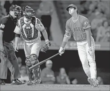  ?? Sean M. Haffey Getty Images ?? IT WAS THAT KIND of night for the Angels, as Shohei Ohtani reacts after striking out in the sixth inning.