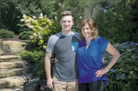  ?? Alex Driehaus/Post-Gazette photos ?? Kerry Boehner poses for a portrait with her son Bill Boehner in their backyard in Mt. Lebanon.