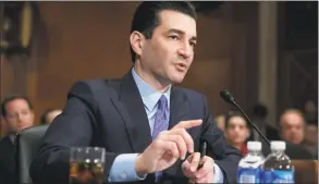  ?? J. Scott Applewhite / Associated Press ?? Dr. Scott Gottlieb, an adviser to Gov. Ned Lamont, is shown in a 2017 file photo from when he was commission­er of the U.S. Food and Drug Administra­tion. Gottlieb said Thursday, “The reality is we have six more months of COVID. This is going to be touch and go.”