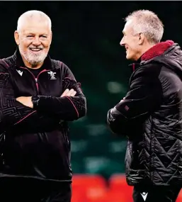  ?? ?? Reunited: Howley (right) is thrilled to be back in Wales set-up