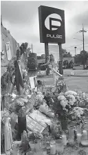  ?? Joe Burbank/Orlando Sentinel/TNS ?? Pulse nightclub owner Barbara Poma tends to the memorial in front of her club on June 10 in Orlando, Fla. A federal judge will decide whether jurors will see statements the widow of the Pulse nightclub shooter made to FBI agents the day of the attack.