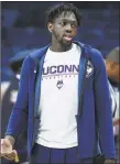  ?? Jessica Hill / Associated Press ?? Mamadou Diarra will remain with the Huskies as a student assistant coach.