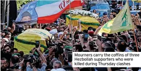  ?? ?? Mourners carry the coffins of three Hezbollah supporters who were killed during Thursday clashes