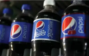  ?? JUSTIN SULLIVAN/GETTY IMAGES ?? PepsiCo boosted its annual forecast as the company’s second-quarter earnings handily beat Wall Street estimates.