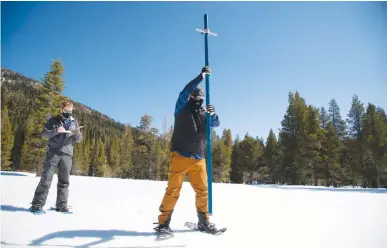  ?? Courtesy photo ?? Members of the Department of Water Resources’ snow survey and water supply forecast section conduct the fourth manual snow survey of the year at Phillips Station in the Sierra Nevada Mountains on Thursday.