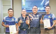  ?? ?? Kamarul (left) and Chee Haw receive the certificat­e from Malaysia Wushu Federation president Datuk Dr Chong Kim Fatt (second right).