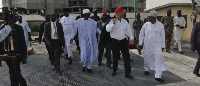  ??  ?? Salini Nigeria Ltd. MD, Piere Capitanio (2nd right), takes FCT Minister, Mohammed Musa Bello (2nd left) and others, on tour of constructi­on site