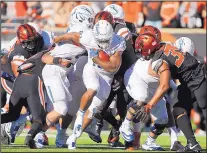  ?? TIMOTHY J. GONZALEZ/ASSOCIATED PRESS ?? Boise State running back Jeremy McNichols, center, has helped the Broncos to a 3-0 record this season.