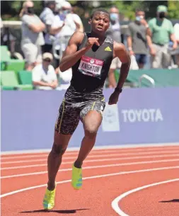  ??  ?? Erriyon Knighton wins a 200-meter heat in 20.04 seconds for the top time during the U.S. Olympic track and field trials on June 25.