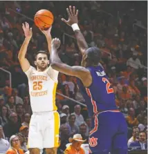  ?? AP PHOTO/WADE PAYNE ?? Tennessee guard Santiago Vescovi shoots over Auburn forward Jaylin Williams during the first half of Saturday’s SEC matchup of ranked teams at Thompson-Boling Arena.