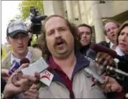  ?? DAVID DUPREY, FILE — ASSOCIATED PRESS ?? In this Thursday, Oct. 23, 2003, file photo, Kirk Jones of Canton, Mich., the man who survived a plunge over Niagara Falls, talks to reporters after being released from custody in St. Catherines, Ontario.