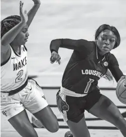  ?? NELL REDMOND/AP ?? Louisville guard Dana Evans drives around Wake Forest guard Kaia Harrison on Sunday in Winston-Salem, N.C.