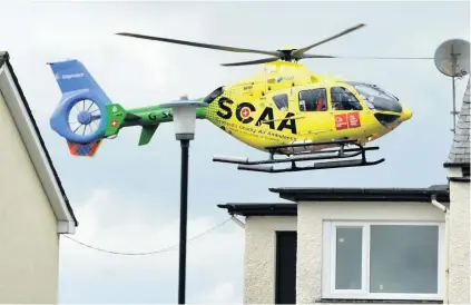  ??  ?? Saving lives The SCAA helicopter arrives back at Perth Airport after another mission