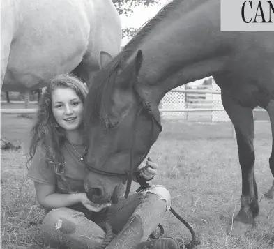  ?? COURTESY GERRIE DANGREMOND ?? Valerie Dangremond with horses Misty and Reiner. The family, who are Dutch immigrants to New Brunswick, have been told they could not keep the horses on their property, which is zoned as residentia­l.