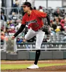  ?? CONTRIBUTE­D PHOTOS BY JEFF GILBERT ?? Dayton pitcher Connor Phillips follows through on a pitch during the season opener.