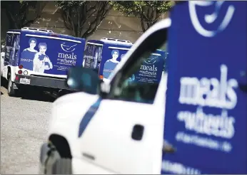  ?? Getty Images/tns ?? Meals On Wheels of San Francisco sit idle on February 27, 2013 in San Francisco, Calif. State and local experiment­s targeting factors such as housing, transporta­tion, food and other nonmedical services are flourishin­g as ways to improve people’s health while cutting costs.