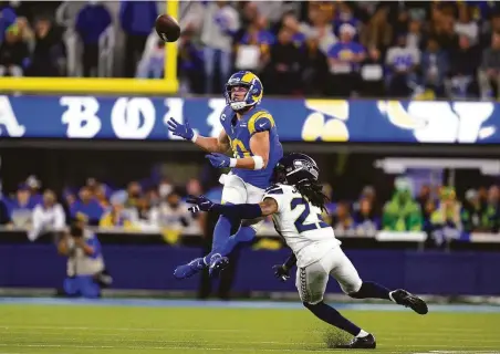  ?? Ashley Landis / Associated Press ?? Rams wide receiver Cooper Kupp, who leads the NFL in receiving, catches a pass over Seahawks cornerback Sidney Jones.