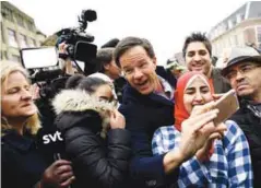  ??  ?? Rutte greets supporters during campaignin­g in The Hague on Tuesday.