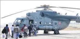  ?? ANI PHOTO ?? Polling officials take electronic voting machines and other election materials in a helicopter for the first phase of the assembly elections, in Daltonganj on Friday.