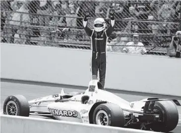  ?? MICHAEL CONROY AP ?? Simon Pagenaud salutes the crowd after winning the Indianapol­is 500 with a pass of Alexander Rossi on the penultimat­e lap. Pagenaud and Rossi swapped the lead five times over the final 13 laps, and the margin of victory was a mere 0.2086 seconds.