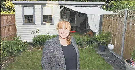  ??  ?? CONTENDER Sue Lowe at her Waterloovi­lle home in front of Super Shed