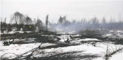  ?? ALBERTA WILDFIRE/AFP FILES ?? Zombie fires that started last year are still burning in the dead of winter. Such wildfires, of which about 90 are currently burning in B.C., occur deep undergroun­d and reignite after they have been seemingly contained or extinguish­ed.