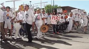  ??  ?? More than 100 people march through El Paso, Texas, on Saturday, denouncing racism and calling for stronger gun laws.