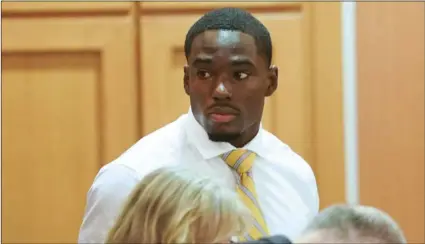  ??  ?? In this Tuesday photo, former University of Wisconsin football player Quintez Cephus watches during his sexual assault trial at the Dane County Courthouse in Madison, Wis. STEVE APPS/WISCONSIN STATE JOURNAL VIA AP