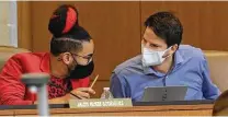  ?? Kin Man Hui / Staff photograph­er ?? Jalen McKee-Rodriguez of District 2 and Mario Bravo of District 1 talk at Thursday’s City Council meeting.