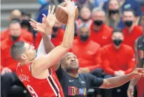  ?? CHRIS SWEDA / CHICAGO TRIBUNE ?? Bulls center Nikola Vucevic and Heat forward P.J. Tucker battle for the ball Saturday at the United Center.