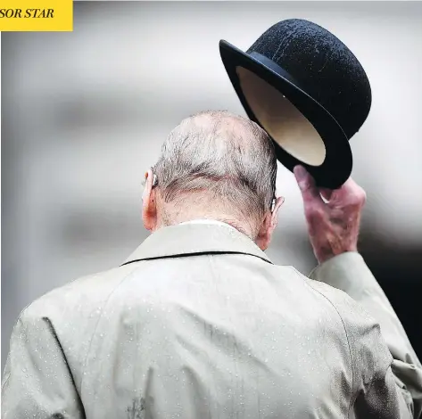  ?? HANNAH MCKAY / AFP / GETTY IMAGES ?? Prince Philip, Duke of Edinburgh, attends a parade to mark the finale of the 1664 Global Challenge on the forecourt of Buckingham Palace. The event was his last official engagement before retiring, following a lifetime of public service by the side of...