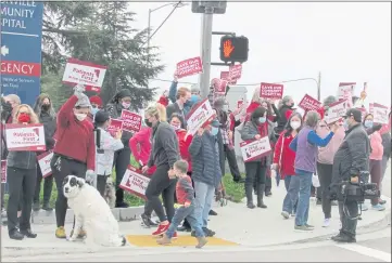  ?? PHOTOS BY MELISSA HARTMAN — SANTA CRUZ SENTINEL ?? Medical workers asking hospital leadership to keep the facility open past the WARN notice date of Jan. 28 gathered on the corner of Airport Boulevard and Nielson Street.