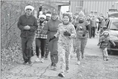  ?? CAROLE MORRIS-UNDERHILL ?? Runners participat­ing in the Fitness Junkies’ annual Ugly Christmas Pyjama Run took the lead Dec. 1 as the popular event got underway.