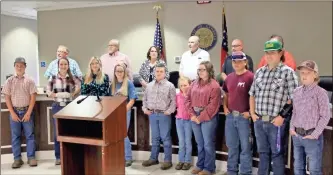  ?? Jeremy stewart ?? Members of the Polk County Junior Cattlemen’s Associatio­n stand with the Polk County Commission after being recognized during its monthly work session Monday, July 6. The group, which included representa­tives from its show team, was praised by organizers and instructor­s.