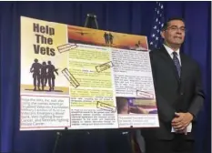  ??  ?? California Attorney General Xavier Becerra announces he is joining regulators in the federal government and other states in targeting charities they say falsely promise to aid veterans and active members of the military, at a news conference in...