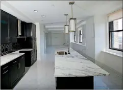  ?? [TOM DODGE/DISPATCH] ?? A 35th-floor condo’s kitchen in the LeVeque Tower