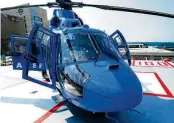  ?? MARSHALL GORBY/STAFF ?? A CareFlight pilot prepares for takeoff off the south pad atop Miami Valley Hospital.