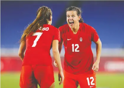  ?? FRANCOIS NEL/GETTY IMAGES ?? Christine Sinclair, right, celebrates Friday with Julia Grosso over Team Canada's first Olympic gold for women's soccer.