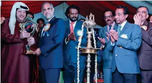  ?? Supplied photo ?? Navdeep Singh Suri presents an Aranmula Kannadi to Sheikh Saeed bin Tahnoon bin Mohammed Al Nahyan during the opening of India Festival in Al Ain. —