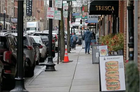  ?? STUART CAHILL — BOSTON HERALD ?? The North End streets won’t be peppered with outdoor tables this spring and summer as the city moves to craft a permanent plan.