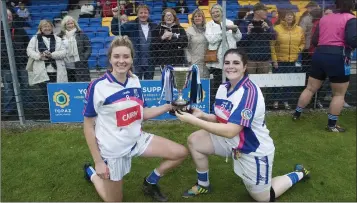  ??  ?? Meadhbh Deeney and Elaina Fusciardi celebrate with the cup.