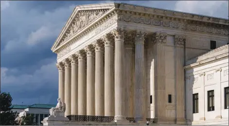  ?? (File Photo/AP/J. Scott Applewhite) ?? The Supreme Court building is seen June 8 in Washington. Stories circulatin­g online incorrectl­y assert that after a legal challenge from Robert F. Kennedy Jr. and a group of scientists, the U.S. Supreme Court ruled covid-19 vaccines are unsafe and “canceled universal vaccinatio­n.” While Kennedy said he has been a part of more than 30 lawsuits on the subject of vaccine safety, those are at different stages of the judicial process and none have appeared before the Supreme Court.