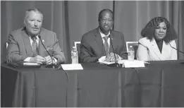  ?? STEPHEN M. DOWELL/ORLANDO SENTINEL ?? Orlando mayor Buddy Dyer answers a question as challenger­s Orlando commission­er district 6 Sam Ings, center, and Aretha Simons, right, listen during a candidate forum.