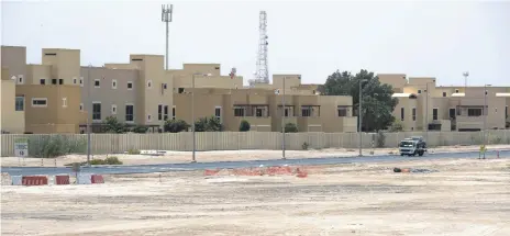  ?? Victor Besa / The National; Al Raha Garden resident ?? Disruption from an upgrade at Al Raha Gardens in Abu Dhabi is causing consternat­ion, above. Loose bricks strewn across the roadway, left