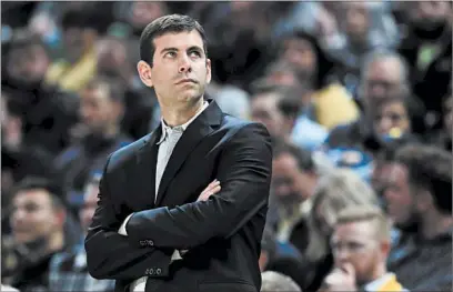  ?? ANDY LYONS/GETTY-AFP ?? Celtics coach Brad Stevens isn’t used to being away from the sidelines as the suspension of the NBA season has surpassed two weeks.