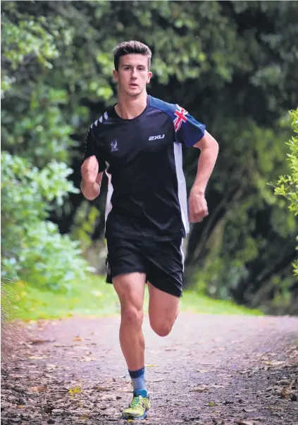 ?? PHOTO: CHRISTINE O’CONNOR ?? On track . . . World U20 Cross Triathlon champion Matthew Clough gets in a training run earlier this week.
